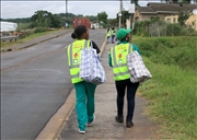 Water agents walk in the street of Chestaville piloting the Block that can save up to 2ltr of water